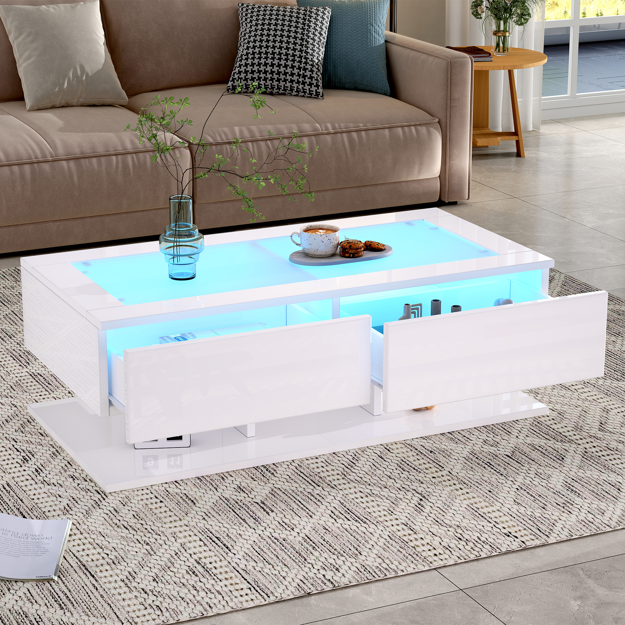 Moderner weißer Couchtisch mit blauer LED-Beleuchtung und offenen Schubladen.