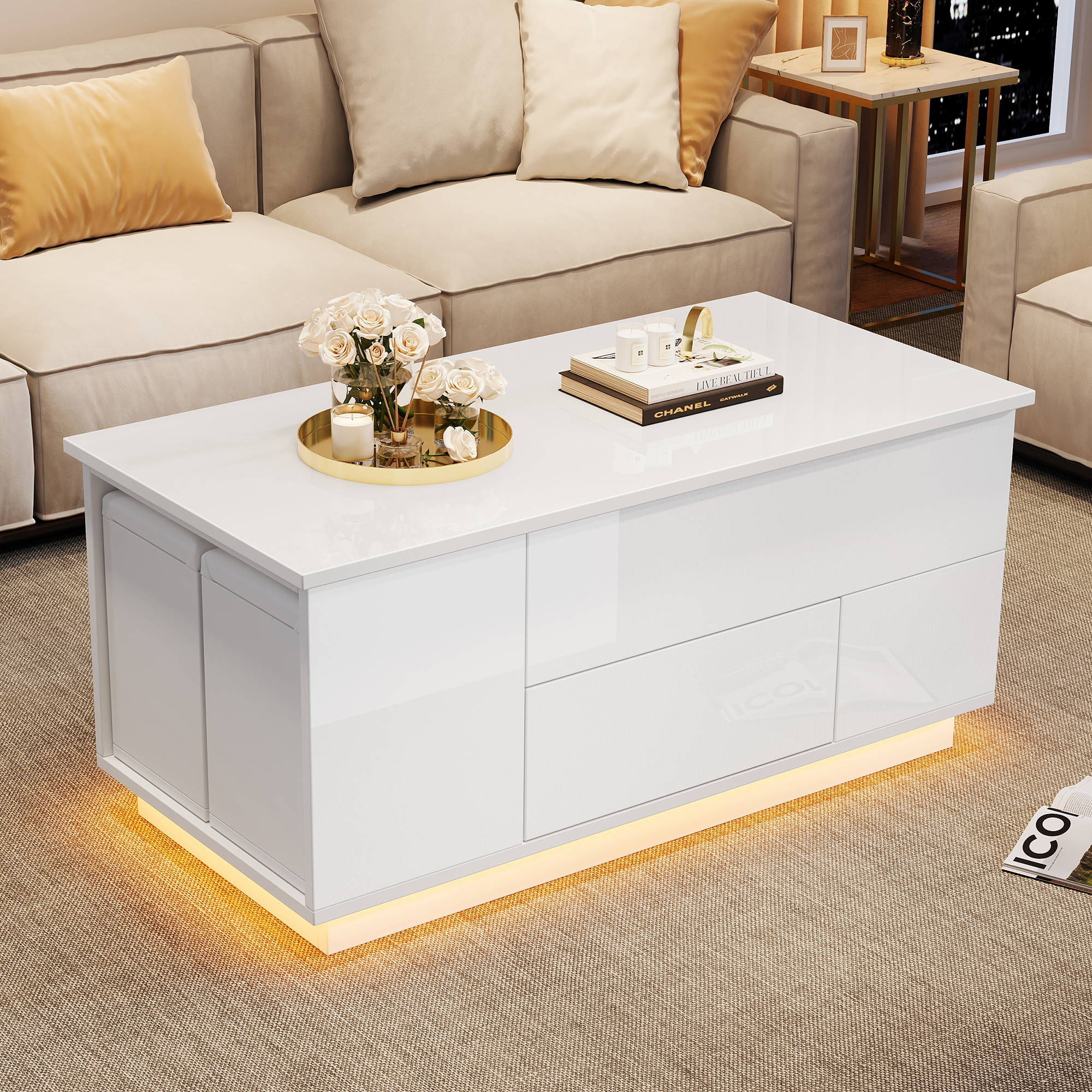Weißer Couchtisch mit Schubladen, beleuchteter Basis, Blumen und Büchern.