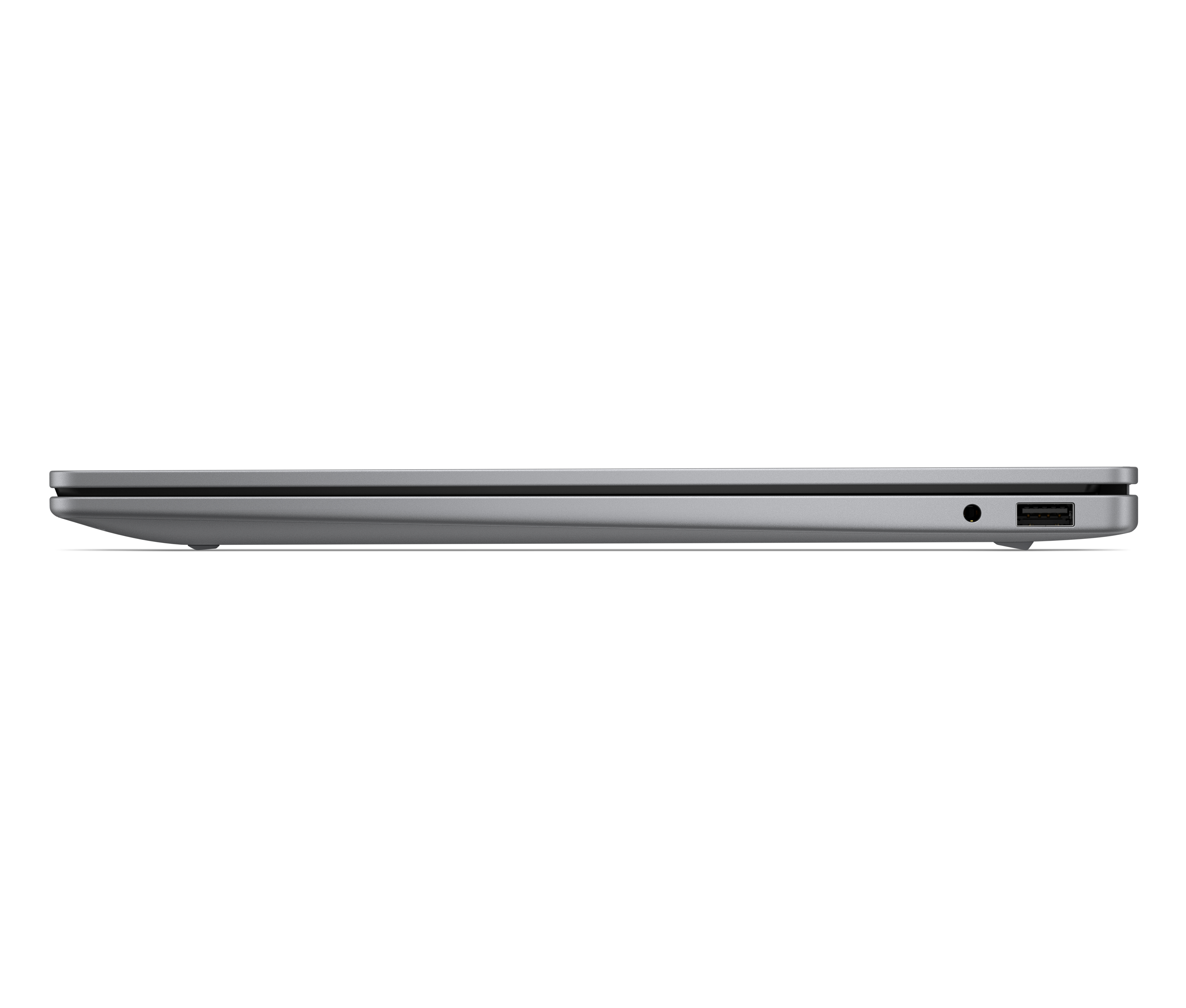 Laptop grigio di lato con porta USB e jack per cuffie.