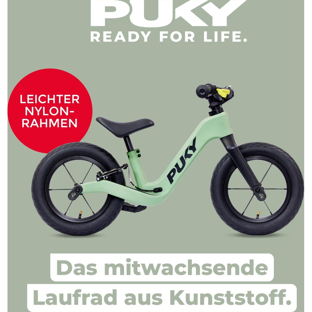 Ein hellgrünes Puky Laufrad mit schwarzen Rädern und Sitz. Leichter Rahmen.