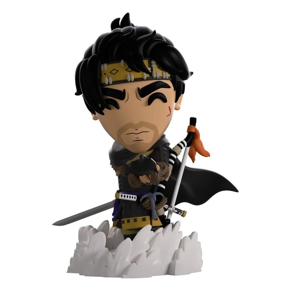 Chibi-Figur eines Samurai mit schwarzem Haar, gelbem Stirnband, schwarzem Umhang und zwei Schwertern.