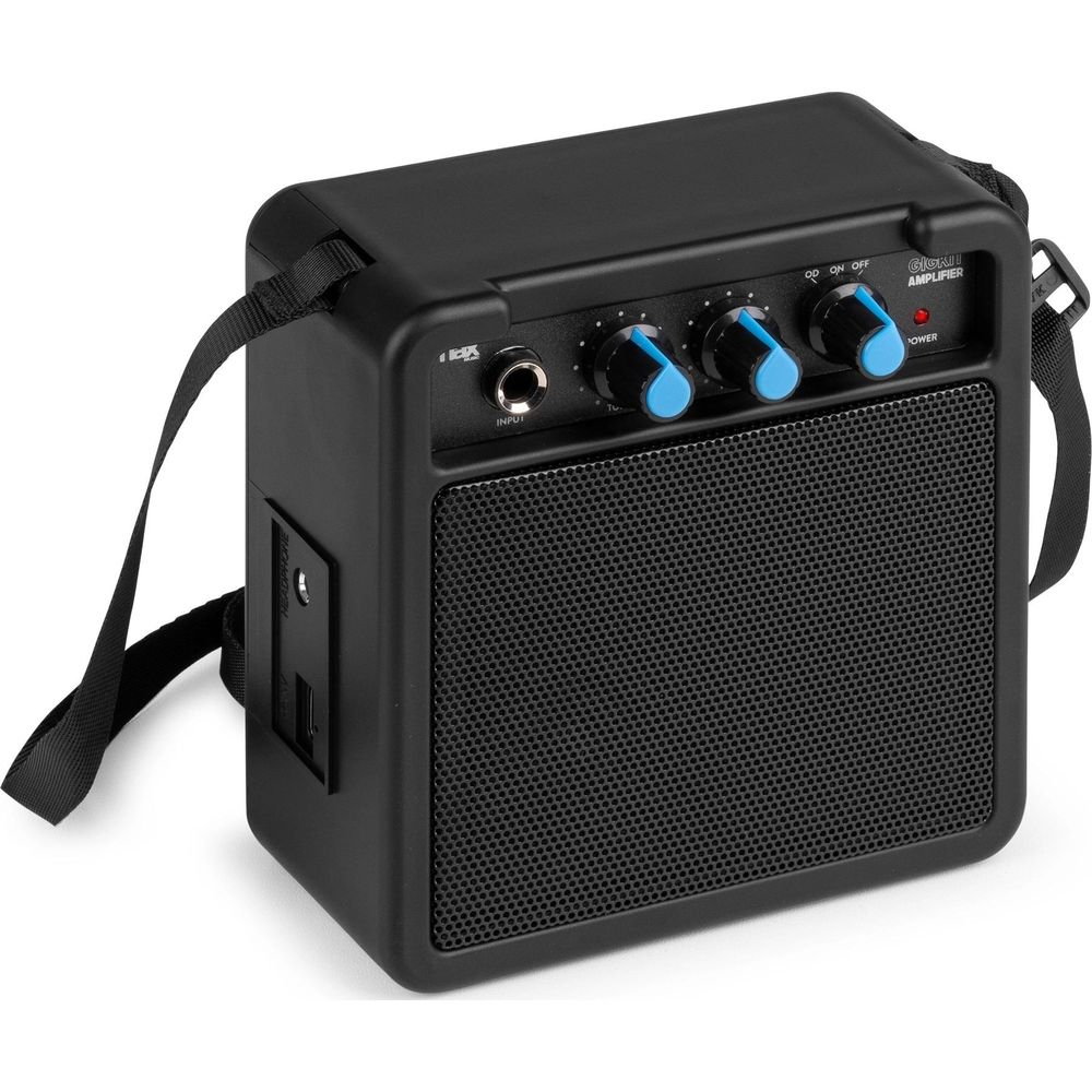 Un amplificador de guitarra portátil negro con rejilla de altavoz y perillas.