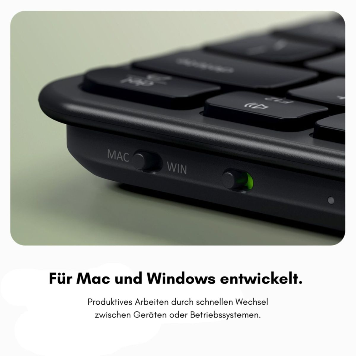 Schwarze Tastatur mit Mac/Win-Umschalter und grüner LED.