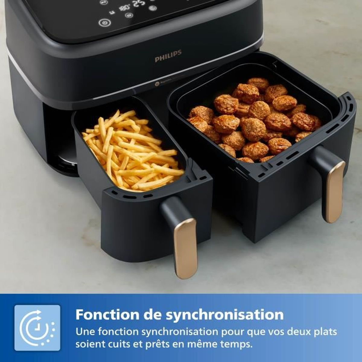 Doppel-Heißluftfritteuse mit Pommes und Fleischbällchen in den Körben.