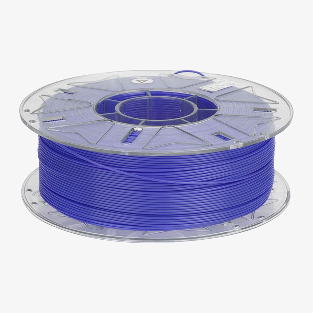 Una bobina di filamento blu brillante per stampa 3D su una bobina di plastica trasparente.