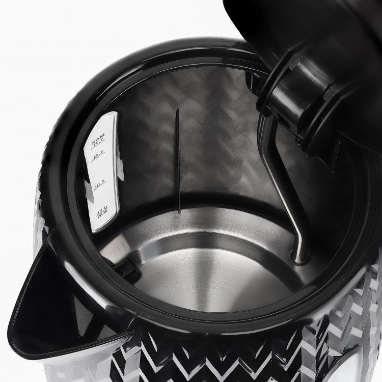 Vista interna di un bollitore nero aperto con base in acciaio inox e indicatore del livello.