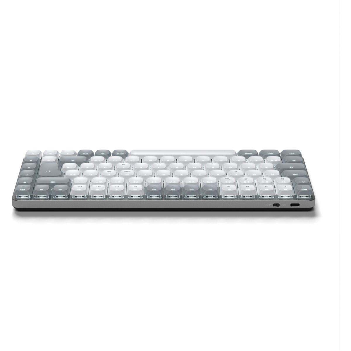 Eine graue und weiße kompakte mechanische Tastatur mit Farbverlauf-Tastenkappen wird gezeigt.