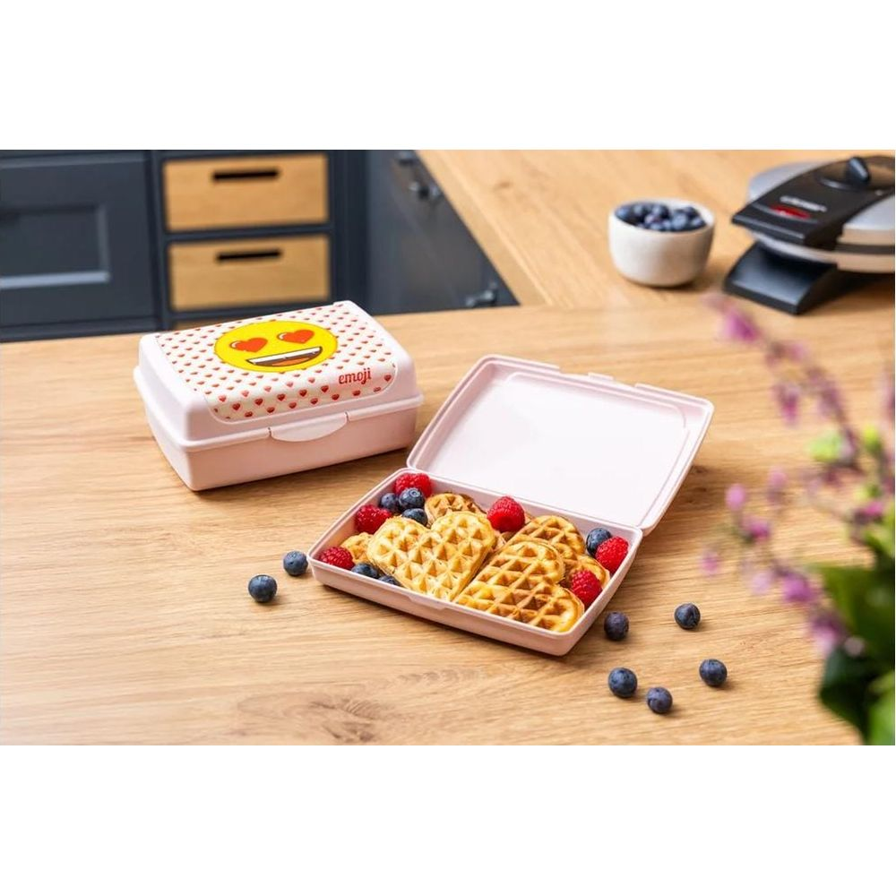 Pinke Brotdose mit Herz-Waffeln, Beeren und Emoji-Design.