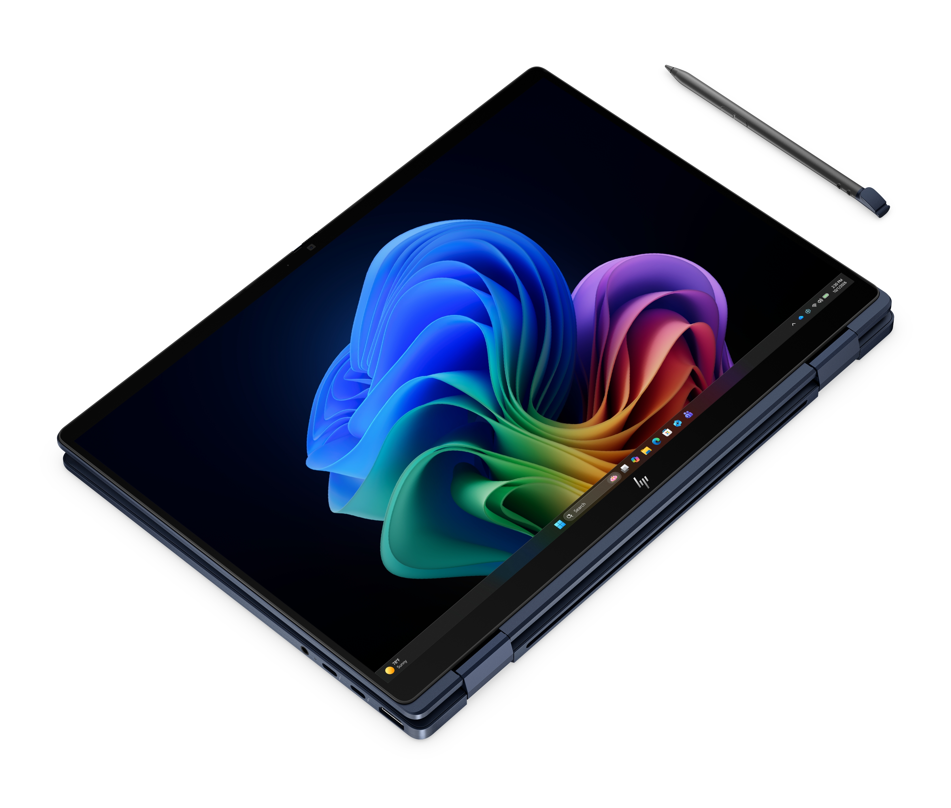 Un laptop convertibile scuro con uno sfondo colorato del desktop e uno stilo nelle vicinanze.