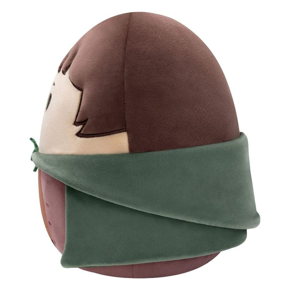 Peluche marron en forme d'œuf, avec visage et écharpe verte.