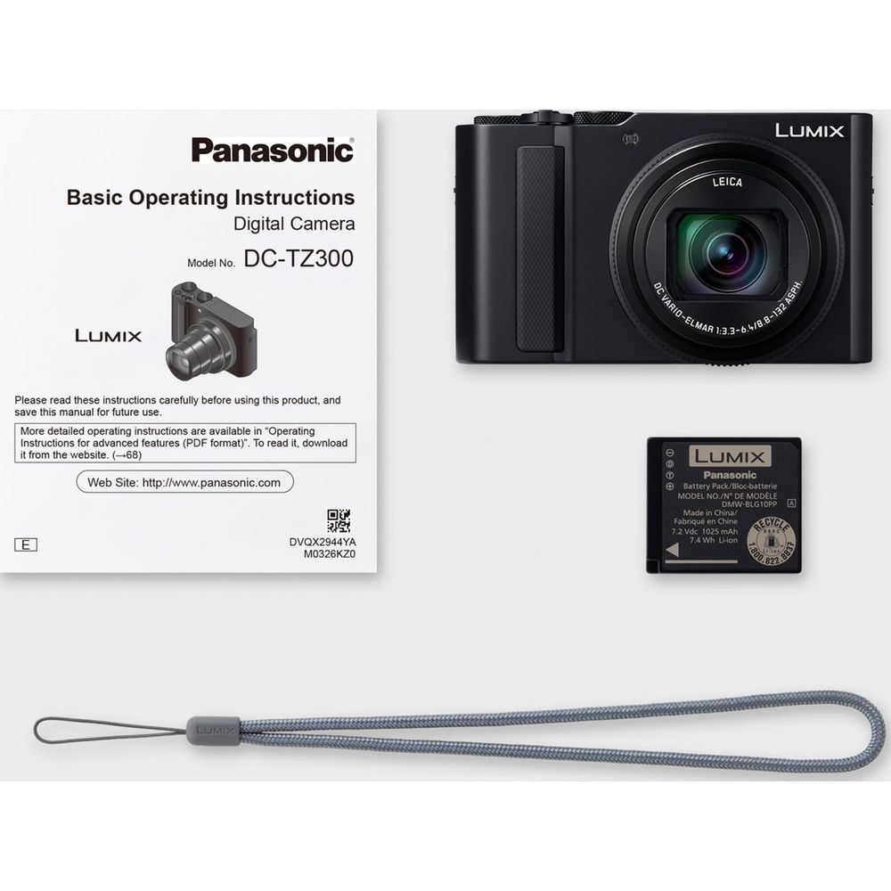 Panasonic DC-TZ300 Kamera, Handbuch, Akku und Handschlaufe.