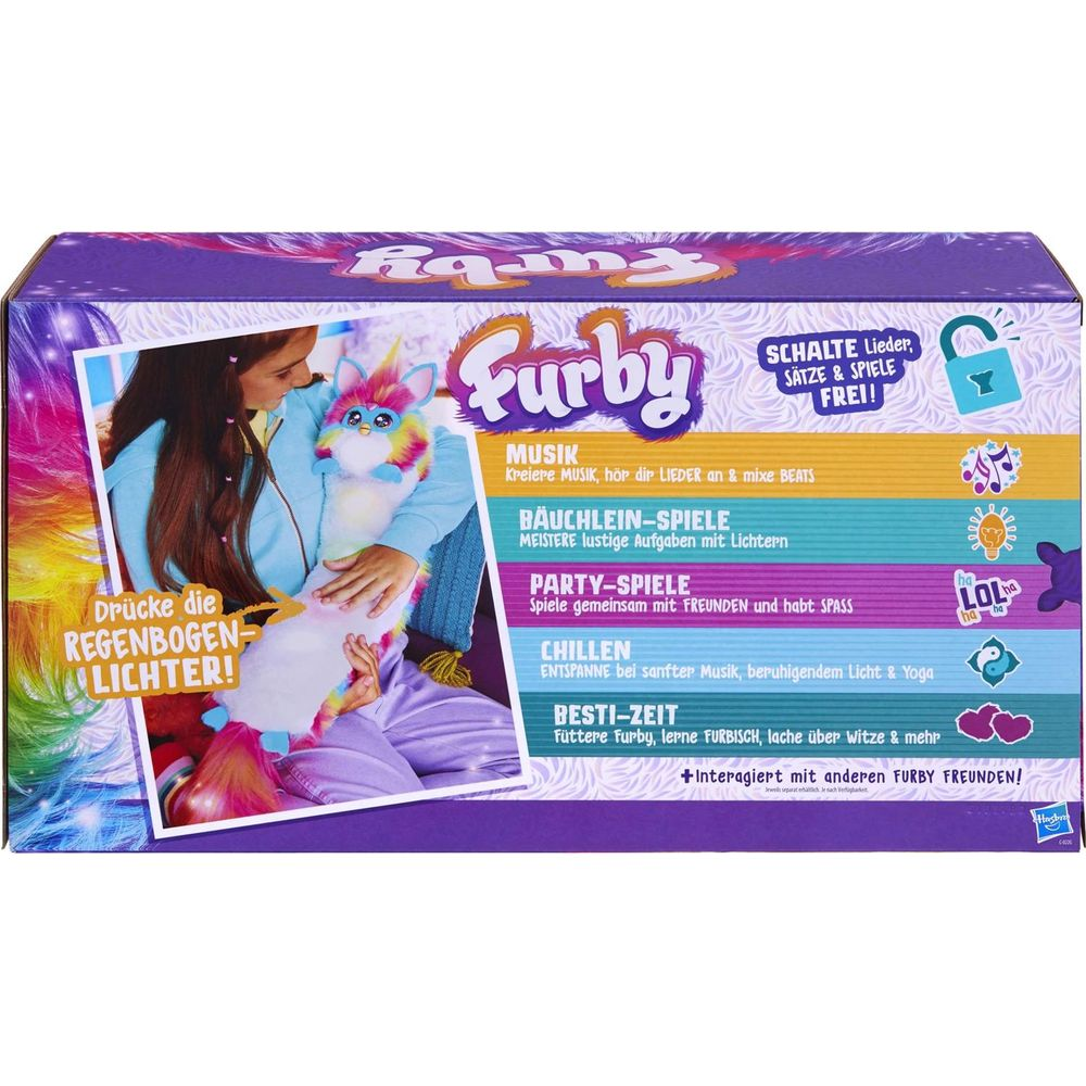 Furby-Verpackung mit Mädchen, das ein Furby-Spielzeug hält, und verschiedenen Spielmodi.