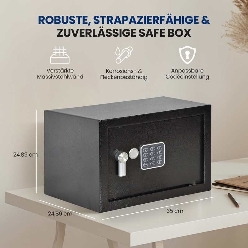 Eine schwarze Safebox mit Tastatur und Schloss steht auf einem weißen Tisch. Maße sind angegeben.