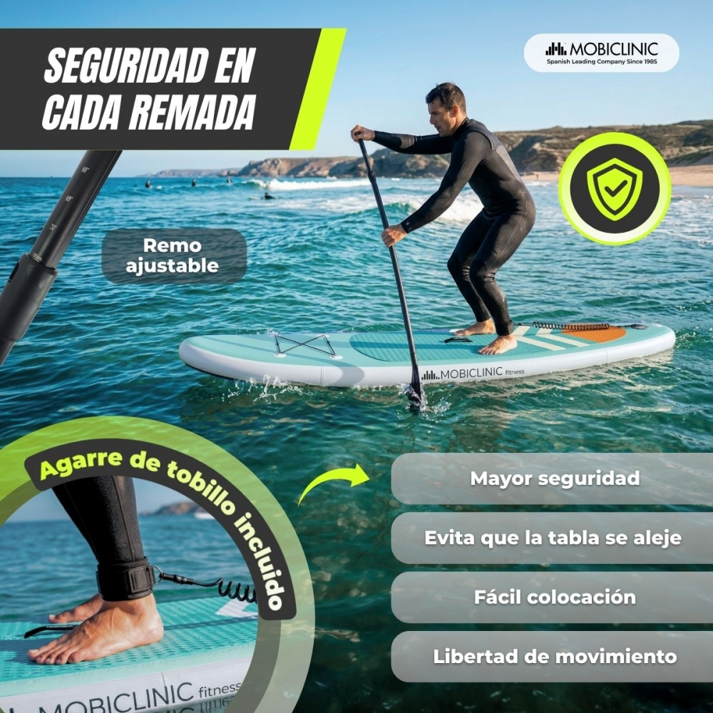 Hombre en neopreno haciendo paddleboard, sujetando un remo. Leash en el tobillo.