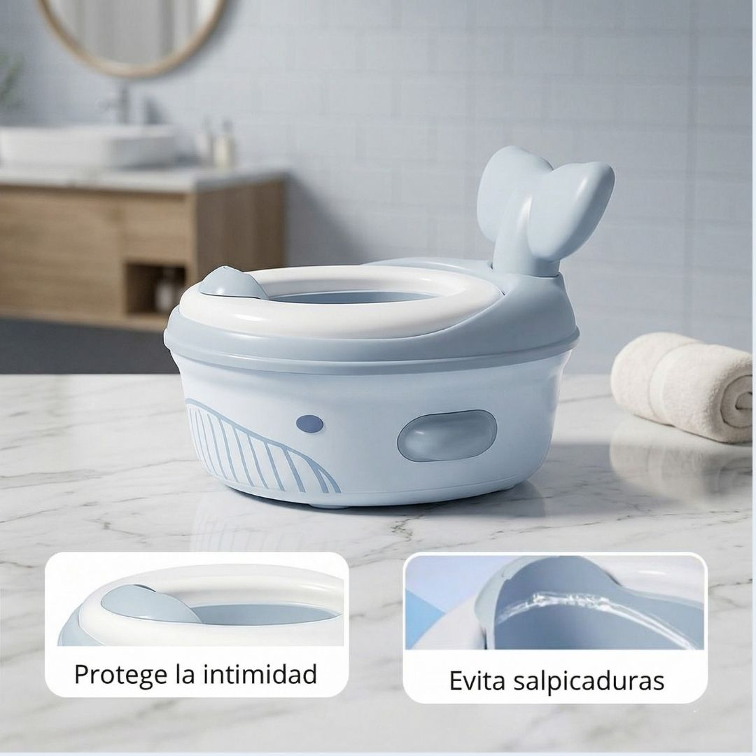 Un orinal azul claro con forma de ballena para niños pequeños está en un mostrador de mármol.