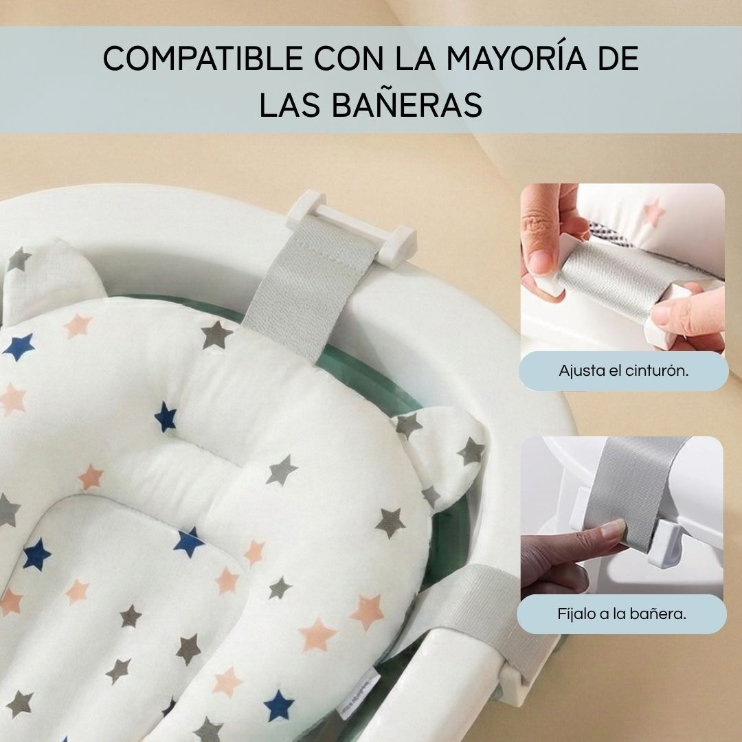 Un asiento de baño para bebés blanco con estrellas, fijado a una bañera.