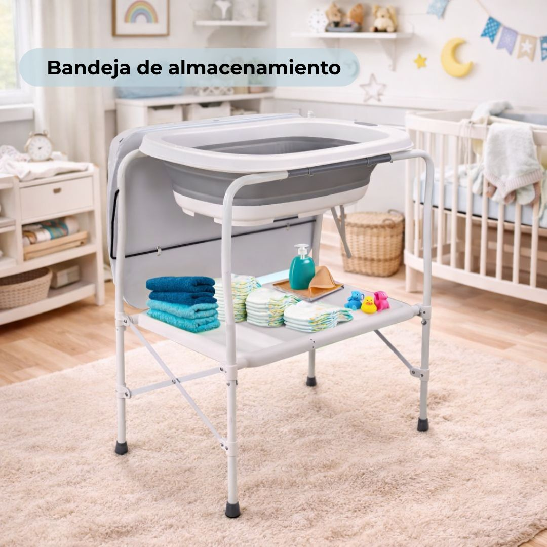 Un cambiador de bebé con bañera plegable, toallas, pañales y juguetes.