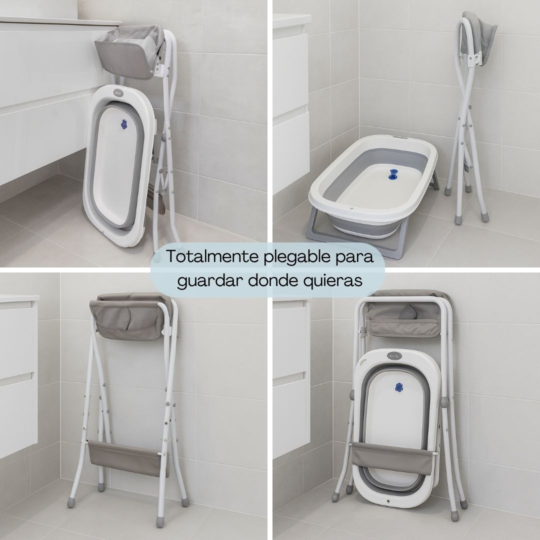 Bañera plegable para bebé en blanco y gris, sobre un soporte.
