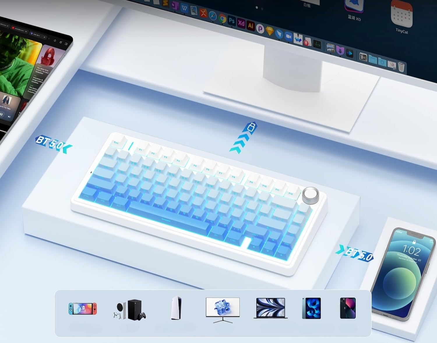 Biała klawiatura z niebieskim podświetleniem, obok smartfona i monitora.