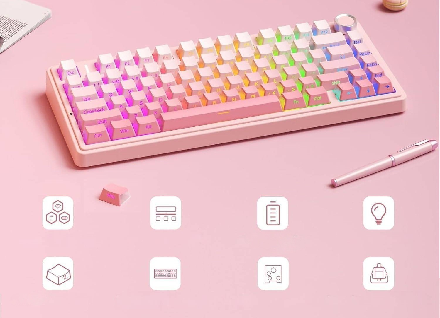 Różowa klawiatura mechaniczna z tęczowym podświetleniem RGB i ikonami poniżej.
