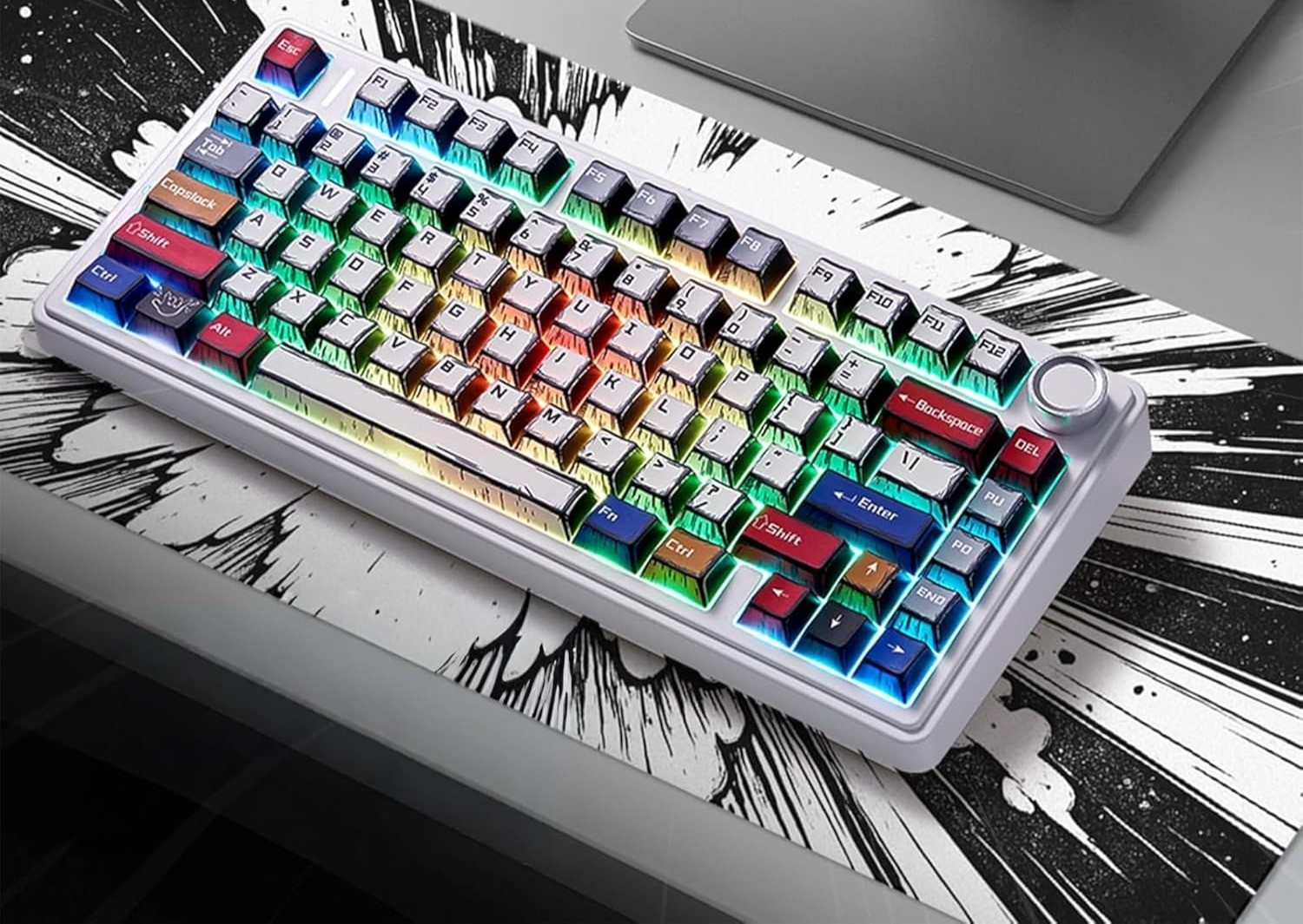 Biała klawiatura mechaniczna z tęczowym podświetleniem RGB na czarno-białej graficznej podkładce pod mysz.