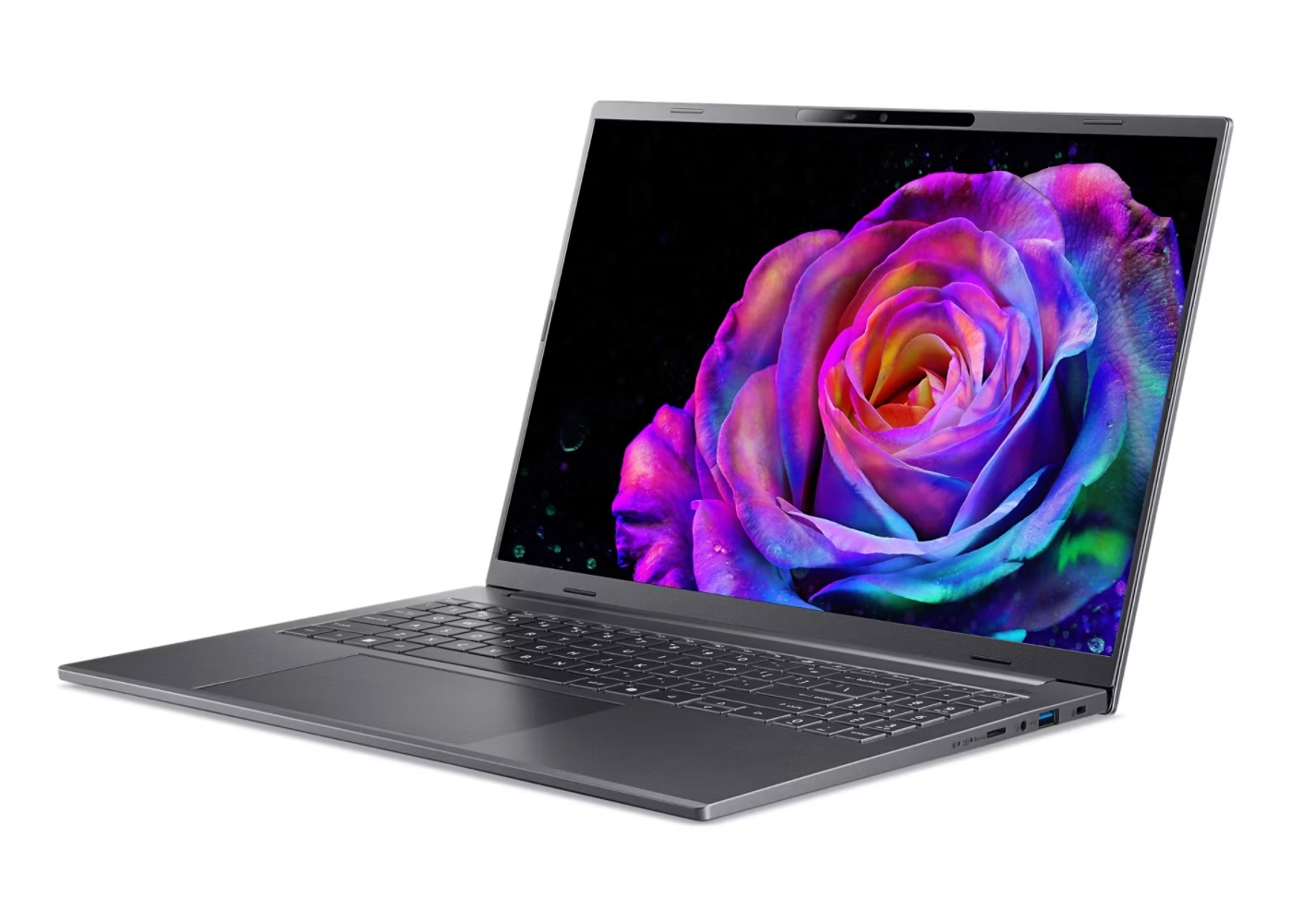 Un laptop grigio con una rosa vibrante e colorata su schermo nero.