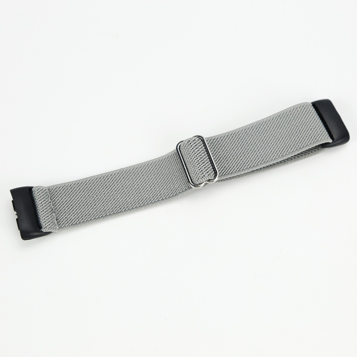 Graues elastisches Uhrenarmband mit Metallschnalle und schwarzen Endstücken.