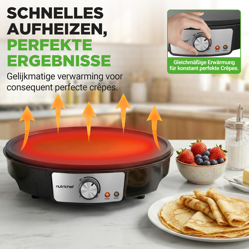 Eine elektrische Crêpe-Maschine heizt auf, mit Beeren und Pfannkuchen daneben.