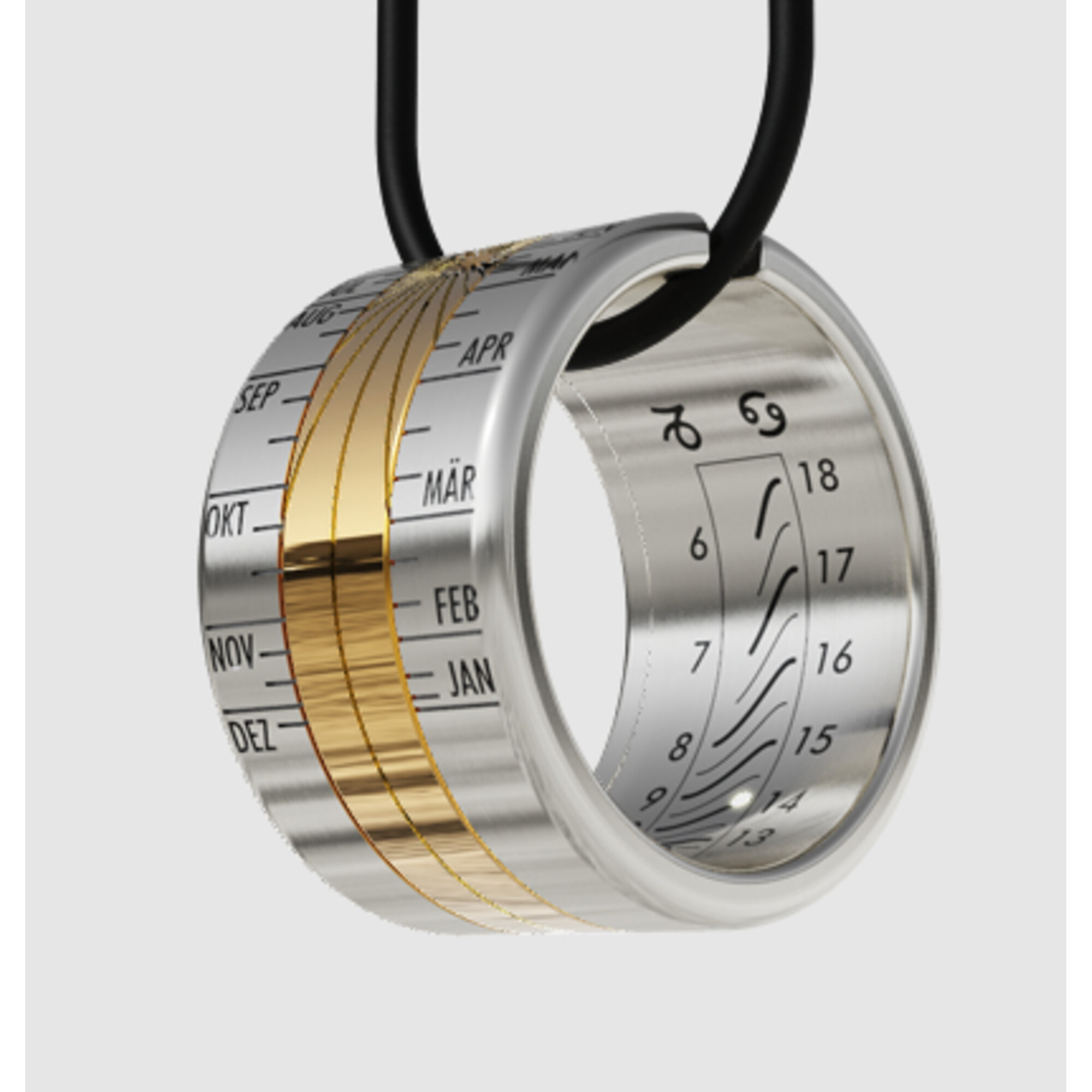 Ein silberner Ring mit Goldband, zeigt Monate und Tierkreiszeichen.