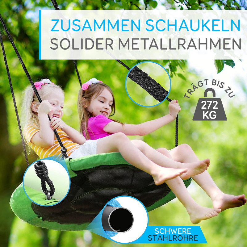 Zwei lachende Kinder schaukeln auf einer grünen Nestschaukel, die bis zu 272 kg trägt.