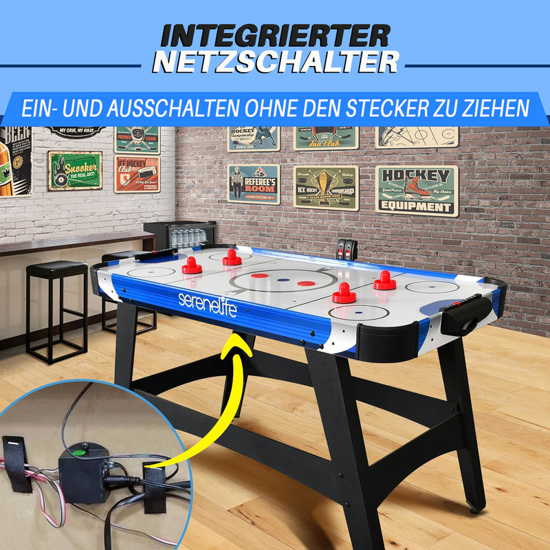 Ein integrierter Netzschalter für ein Hockeytisch mit roten Puckschlägern und Dekoration.