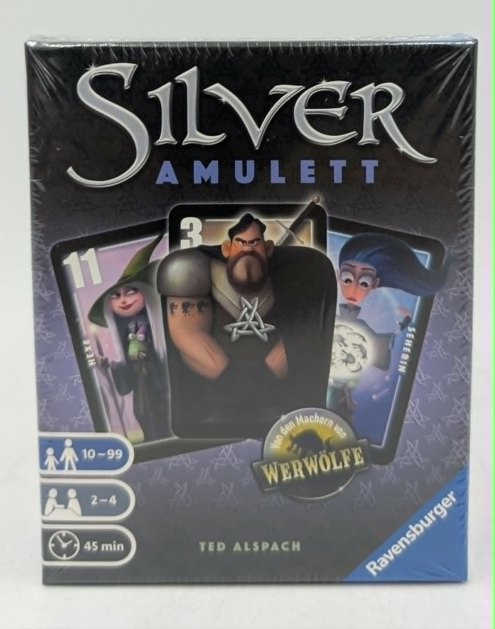 Brettspiel-Box 'Silver Amulett' mit Cartoon-Figuren: Hexe, Mann, Seherin.