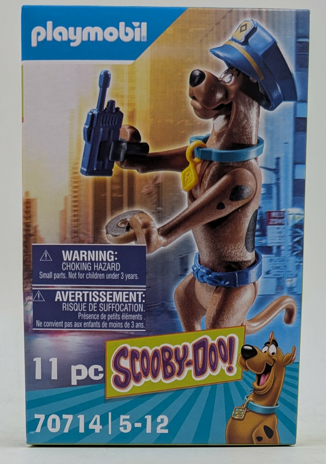Personaggio Playmobil Scooby-Doo! con cappello da poliziotto blu e walkie-talkie.