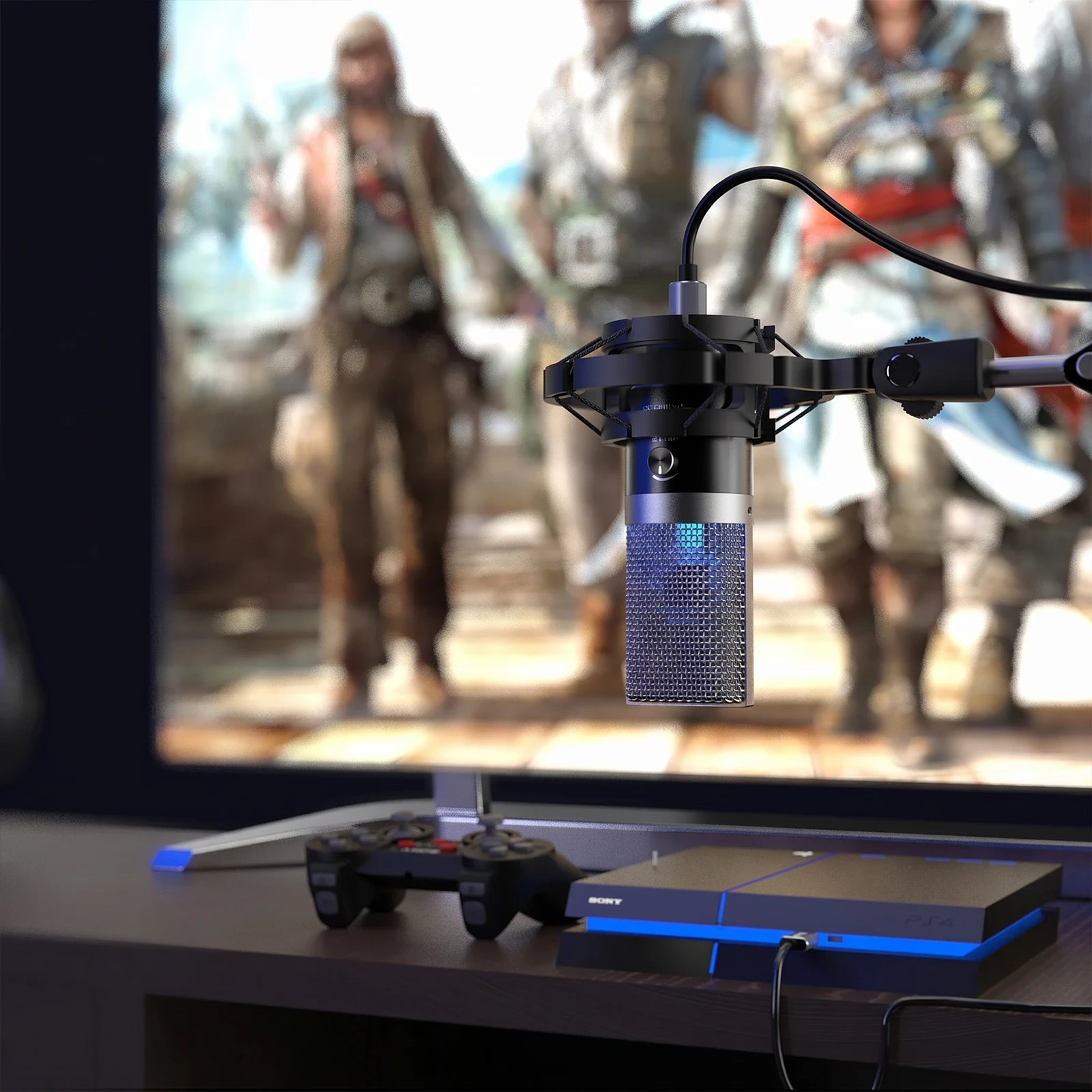 Oyunları gösteren bir ekranın önünde mikrofon. Masada PS4 ve kontrol cihazı var.