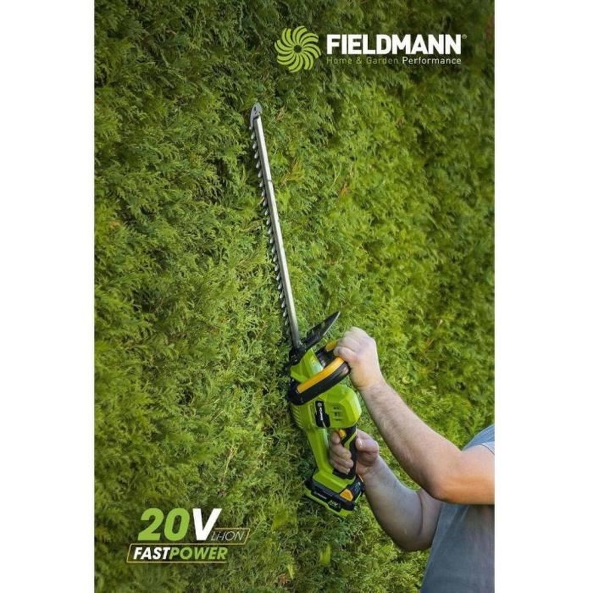 Un uomo pota una siepe con un tagliasiepi verde e giallo.
