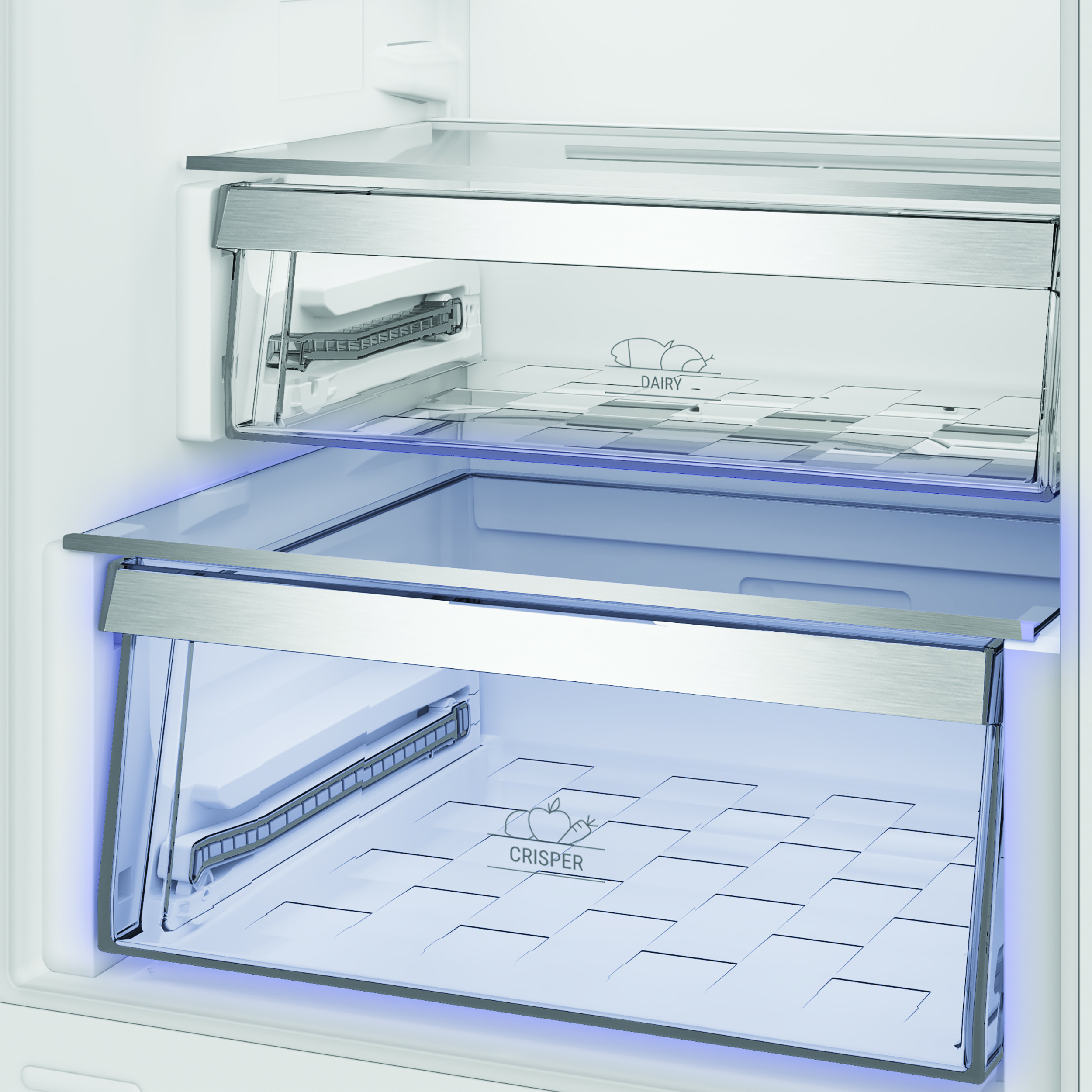 Un frigorifero con due cassetti, uno etichettato 'DAIRY', l'altro 'CRISPER'.