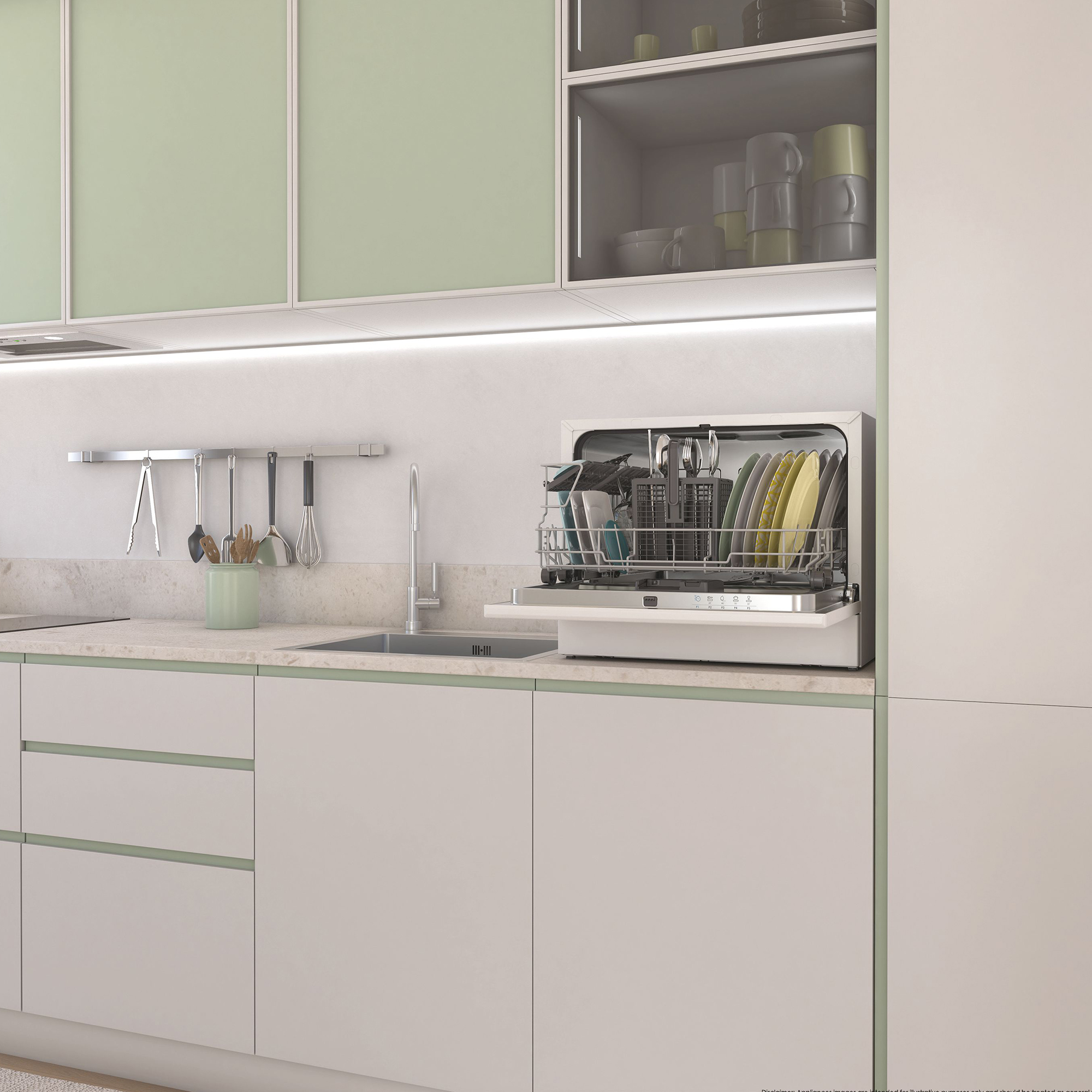 Una cocina moderna con gabinetes verde claro y blancos, una encimera de color claro y un lavavajillas abierto lleno de platos.