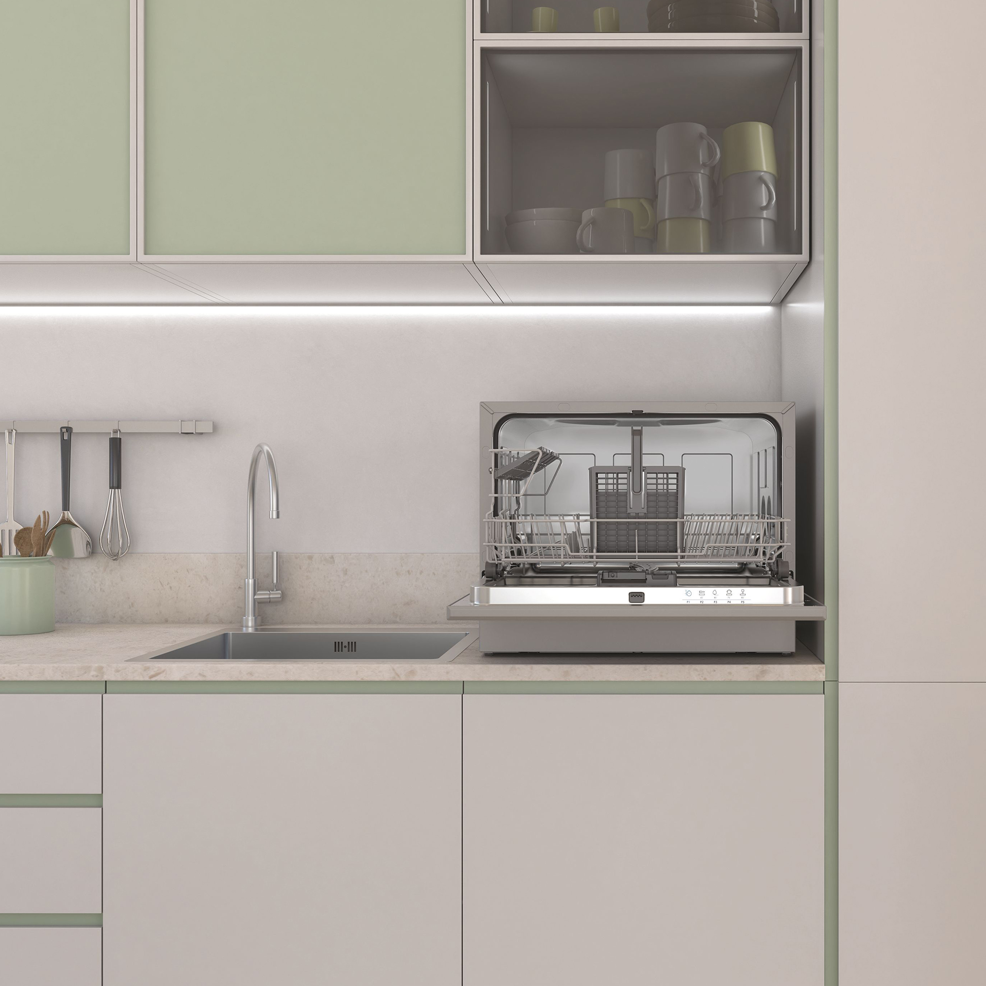 Un lavavajillas abierto junto a un fregadero en una cocina moderna con gabinetes verdes.
