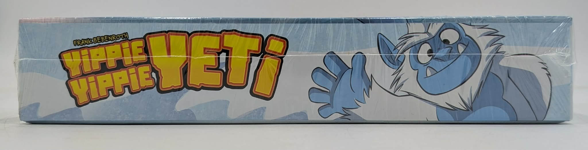 Kartenspiel "Yippie Yippie Yeti" mit Cartoon-Yeti und gelben Schriftzug auf blauem Hintergrund.