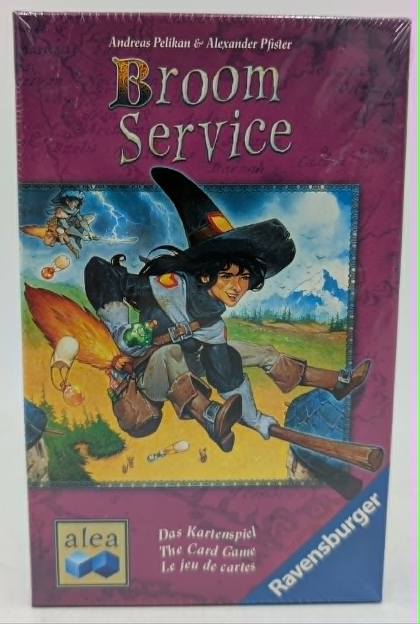 Brettspiel-Cover: Hexe fliegt auf Besen, Gewitter, Berge. Titel: Broom Service.
