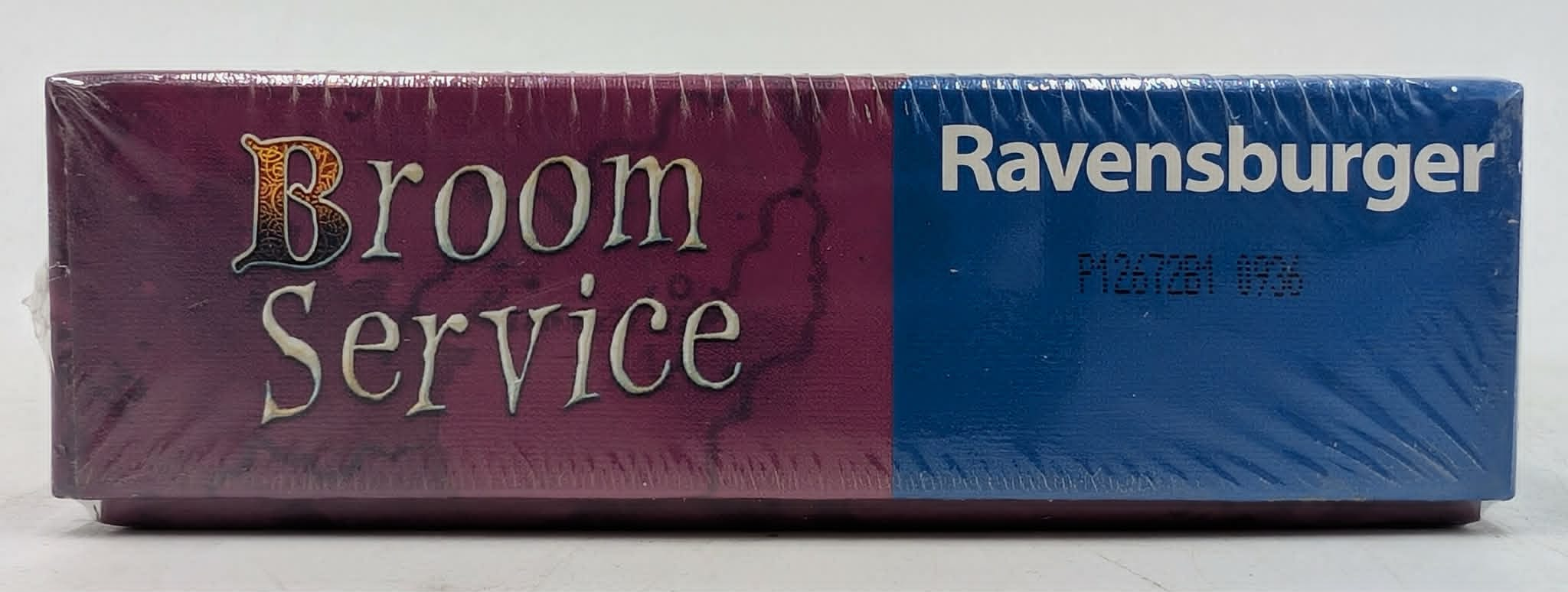 Ravensburger Spiel "Broom Service" auf lila-blauem Karton.