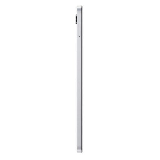 Un tablet argentato mostrato di lato su sfondo bianco.