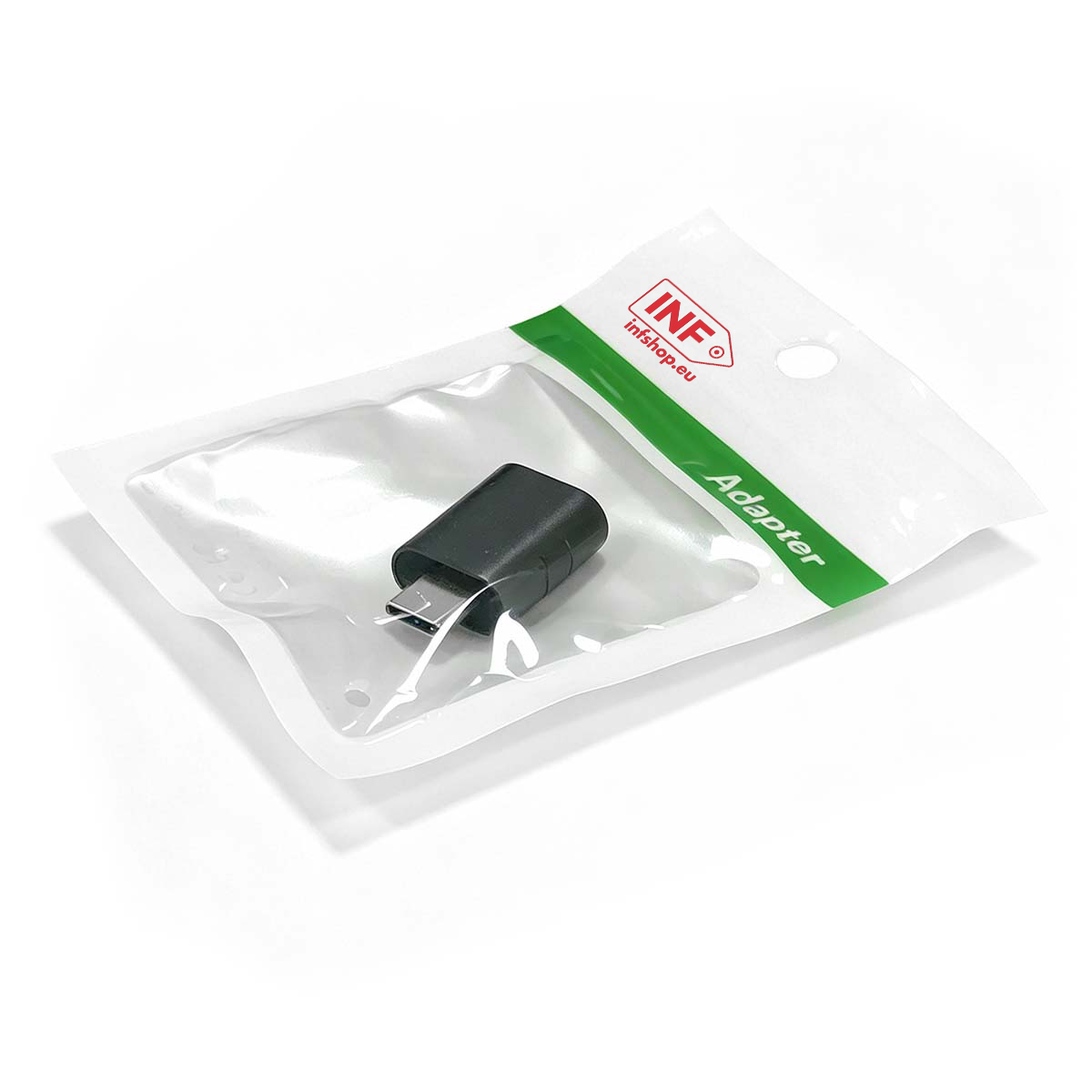 Schwarzer USB-C-Adapter in durchsichtiger Plastikverpackung mit grünem Streifen.