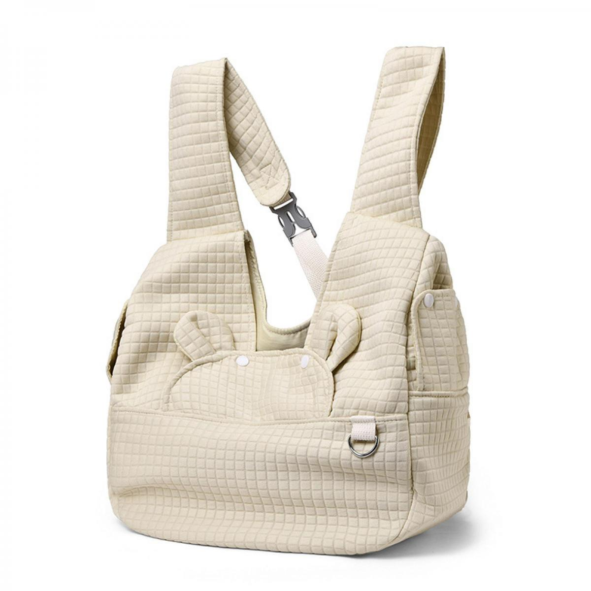 Eine cremefarbene, gesteppte Tasche mit Trägern und süßen Ohren.