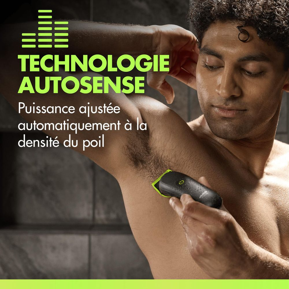 Uomo rade ascella con rifinitore nero e verde. Testo: Tecnologia Autosense.