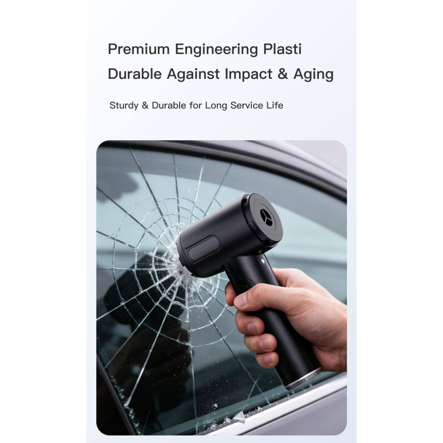 Hand hält schwarzes Werkzeug, das zerbrochenes Autoglas zertrümmert.