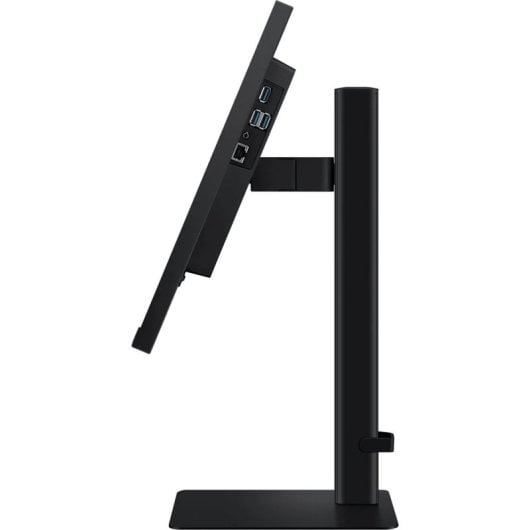Monitor negro sobre soporte, lado de conexión girado a la izquierda.
