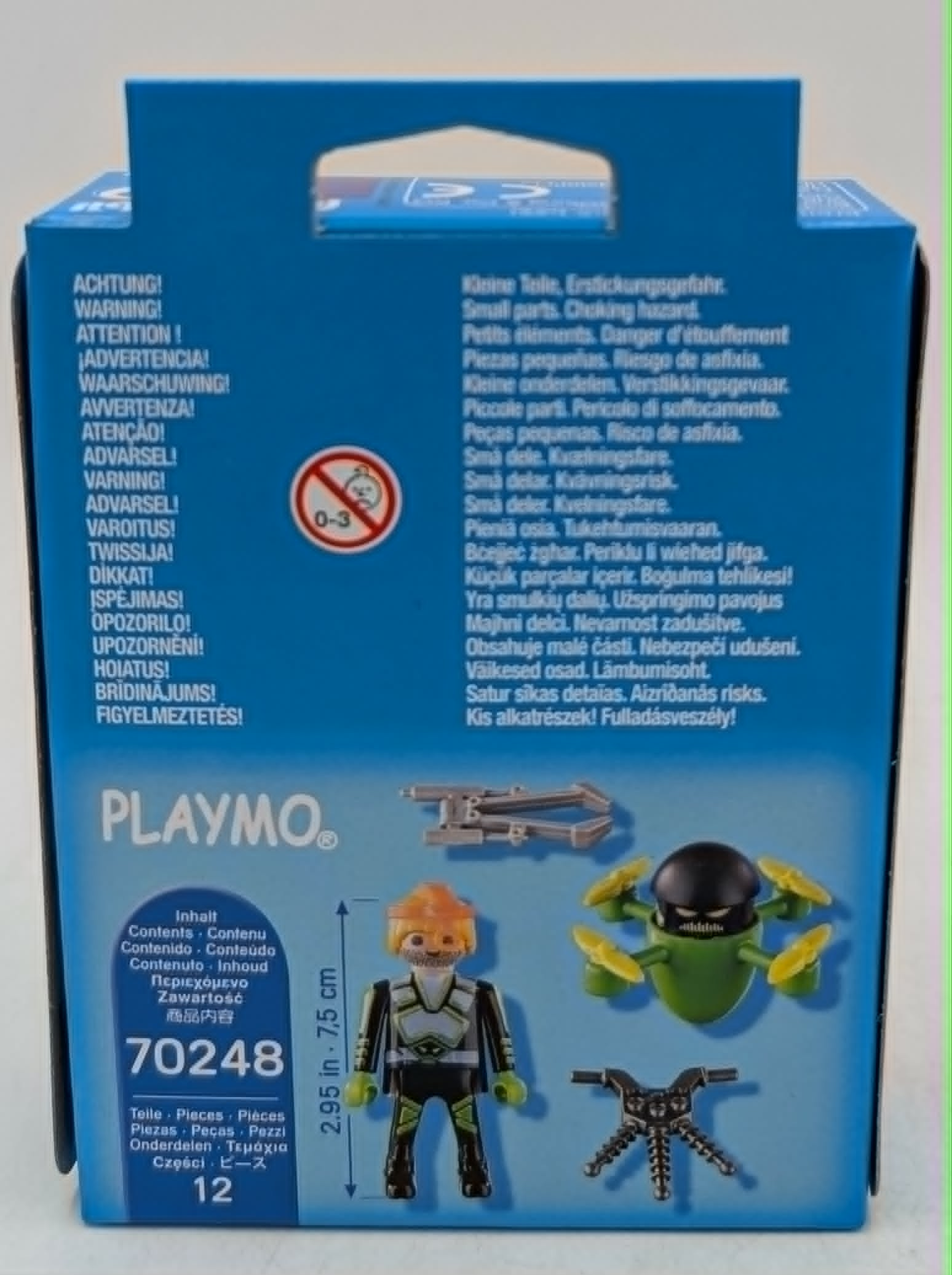 Confezione Playmobil con figure e accessori. Avvertenze in più lingue.