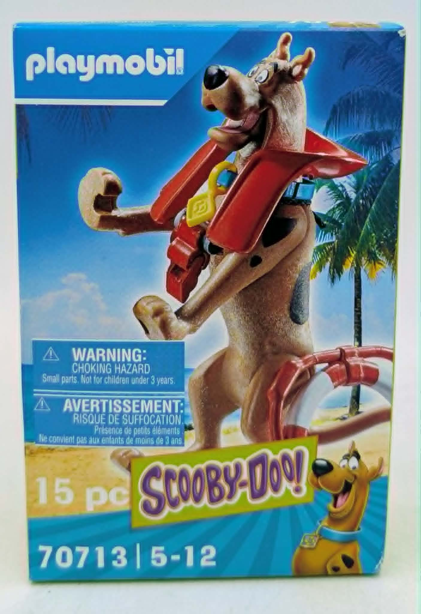 Playmobil Scooby-Doo-Verpackung mit Scooby-Figur, tropischem Hintergrund und Warnhinweisen.