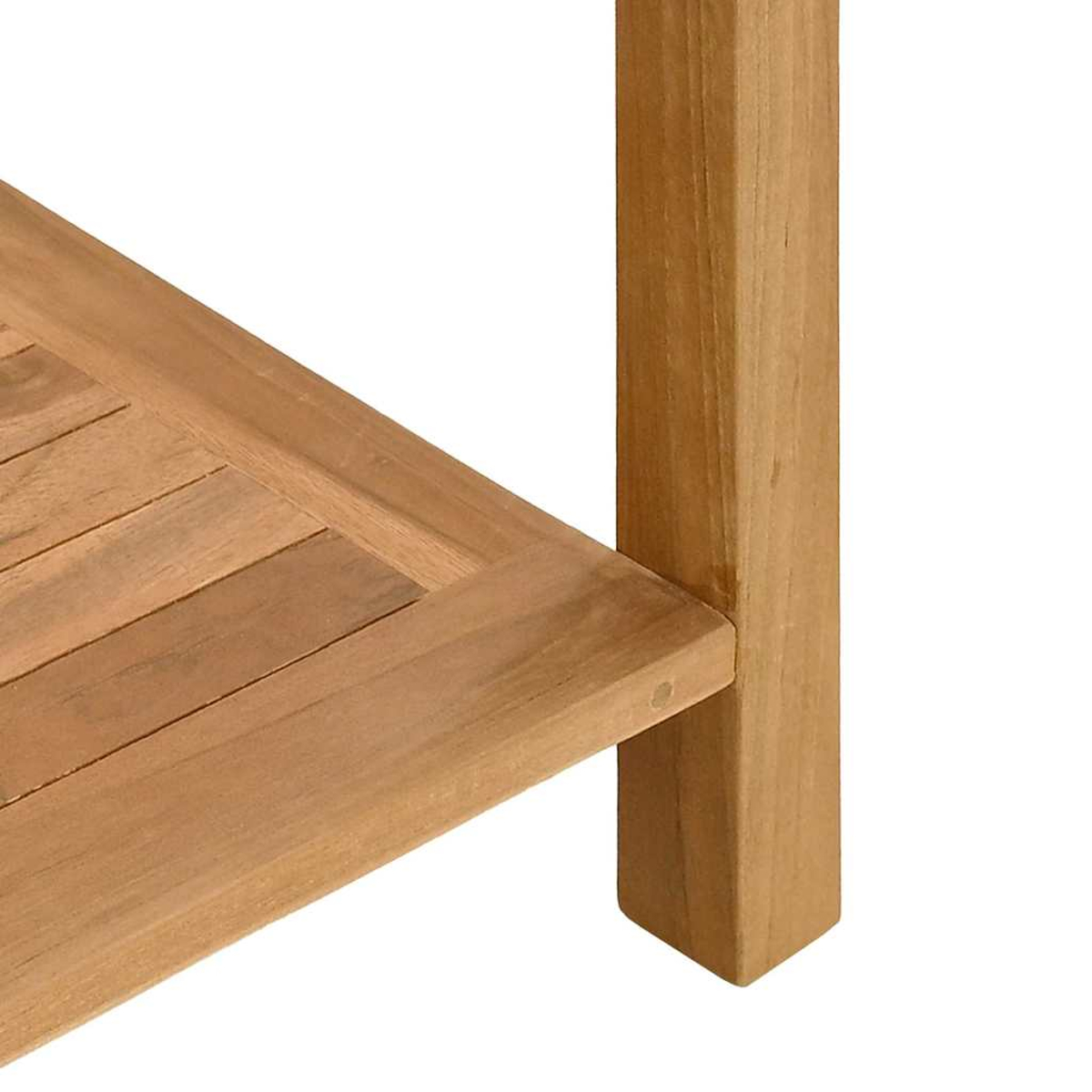 Primer plano de una superficie de listones de madera y una pata de madera.